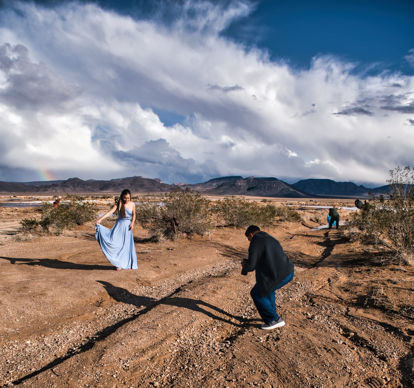 Desert editorial shoot with model in blue dress, rainbow — Las Vegas