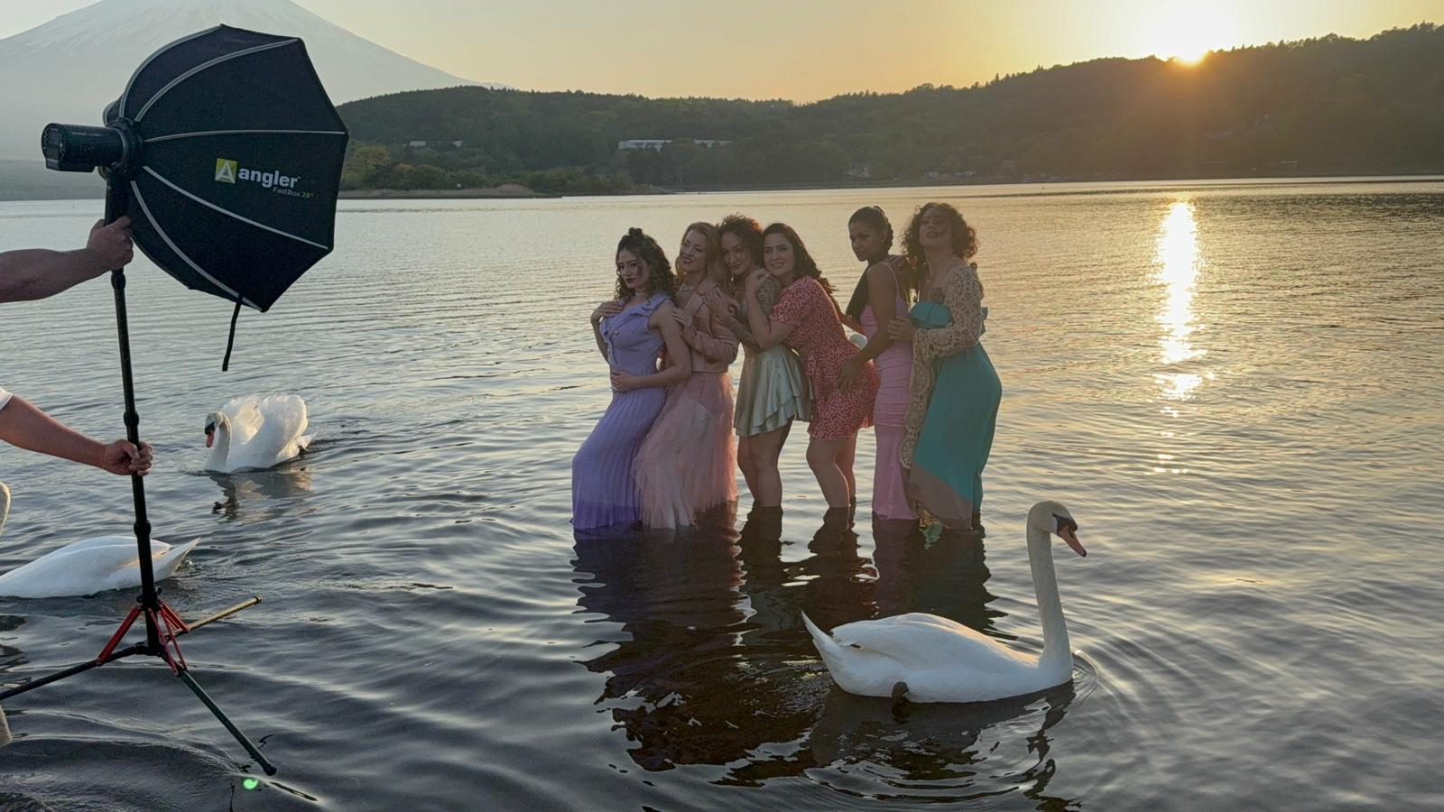 Models in lake with swans at sunset, Mt Fuji — Japan photo shoot