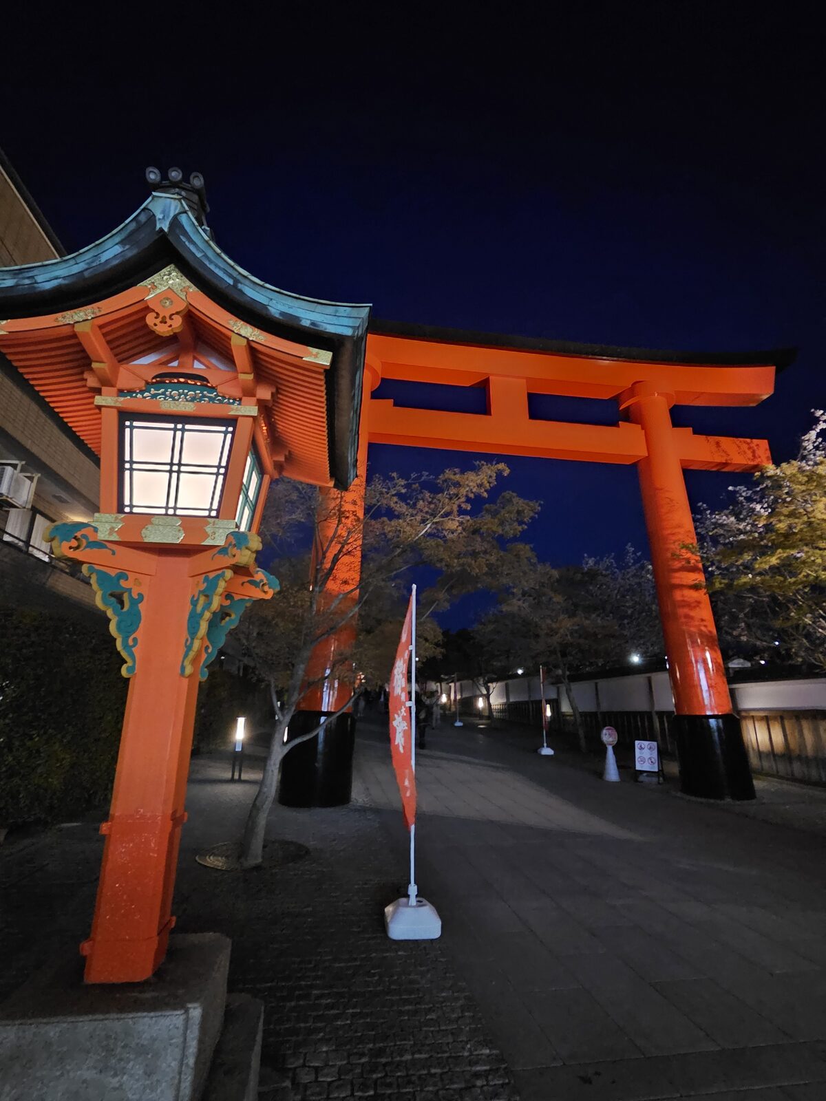 Japanese torii gate illuminated at night — on-location production in Kyoto