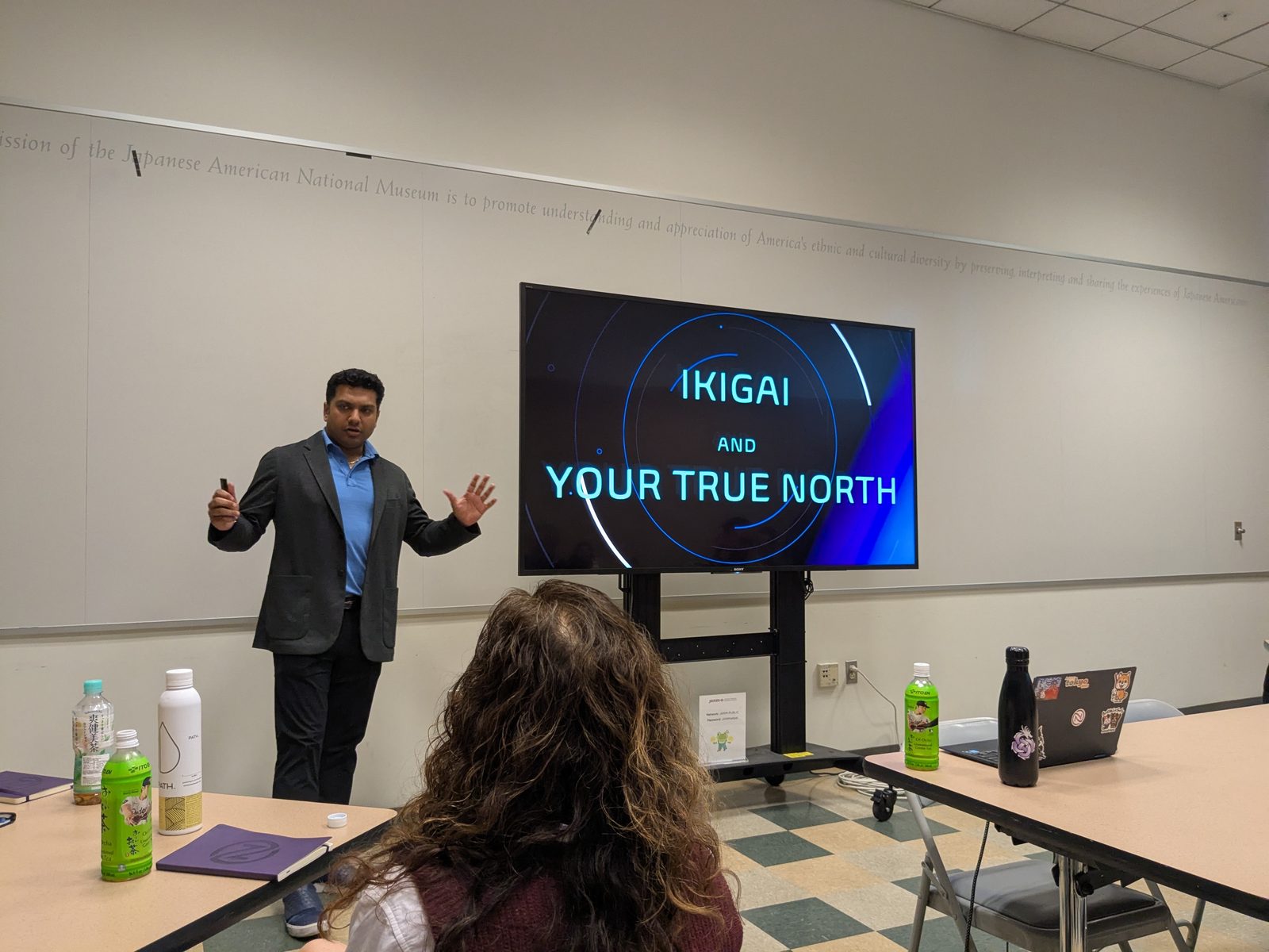 Dr. DhruBee speaking about Ikigai at a community event